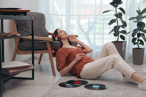 Woman listening to music with turntable