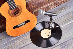 Guitar, vinyl record and microphone